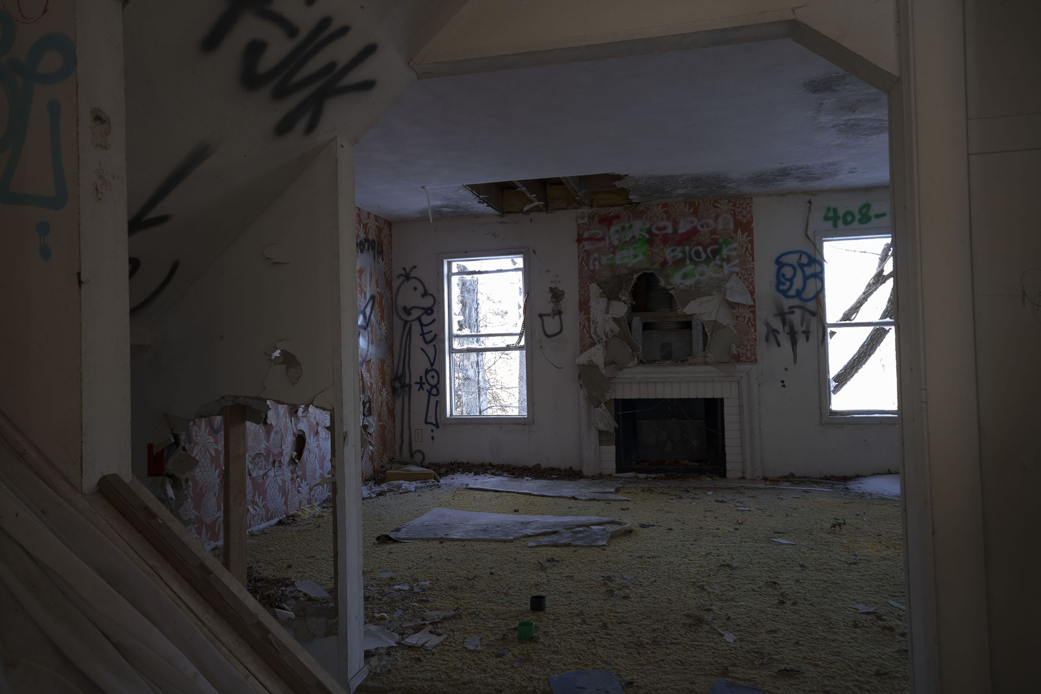 The living room of one these homes, take notice of the faux brick fireplace